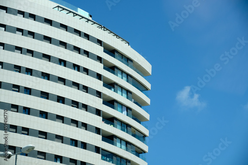 Apartment and condominium building with symmetrical modern architecture in the center of the city.