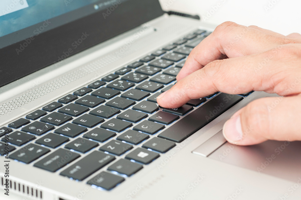 Hand typing on laptop keyboard, working with laptop. Hand typing on laptop keyboard, working with laptop.