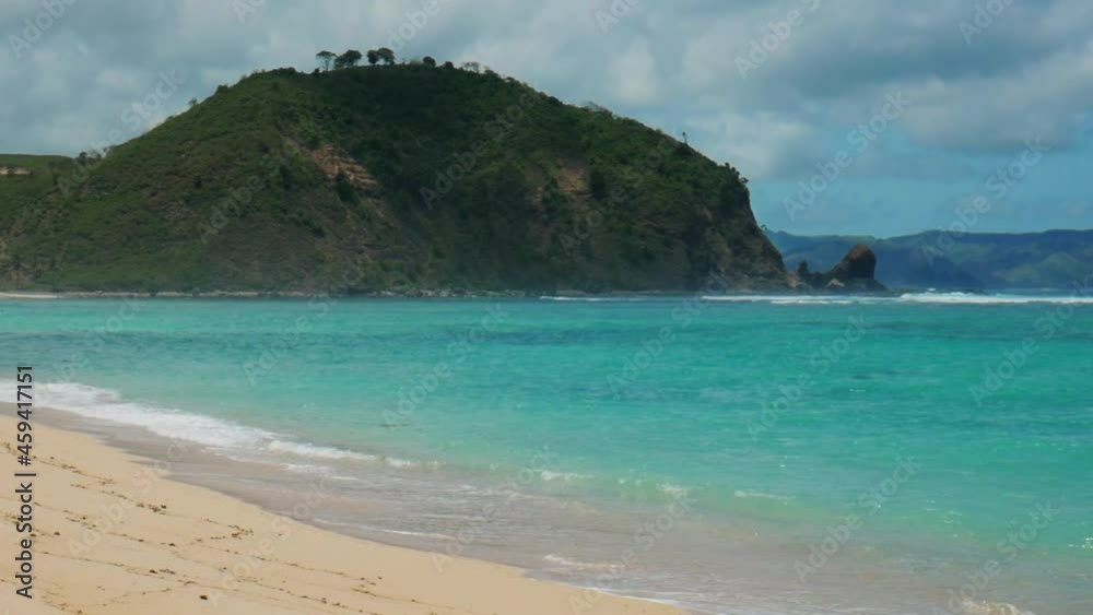 Natural Beach on Lombok Island Indonesia. White sand and turquoise water inside the coral reef. Natural Beach on Lombok Island Indonesia. White sand and turquoise water inside the coral reef.