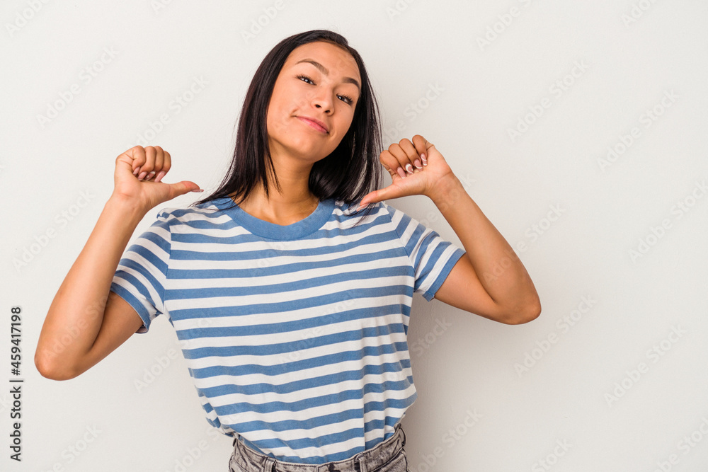 Young latin woman isolated on white background feels proud and self confident, example to follow. Young latin woman isolated on white background feels proud and self confident, example to follow.