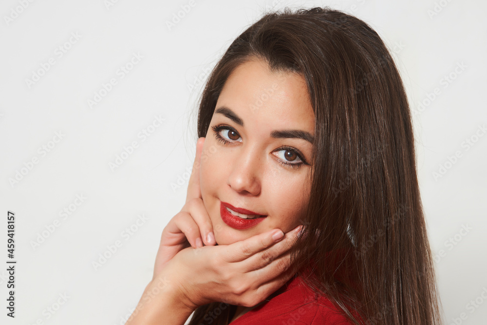 Portrait of a beautiful smiling young girl in red dress Portrait of a beautiful smiling young girl in red dress