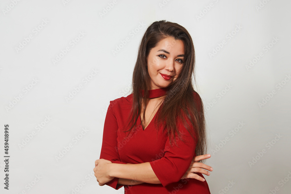 Beautiful woman posing in red dress on white background