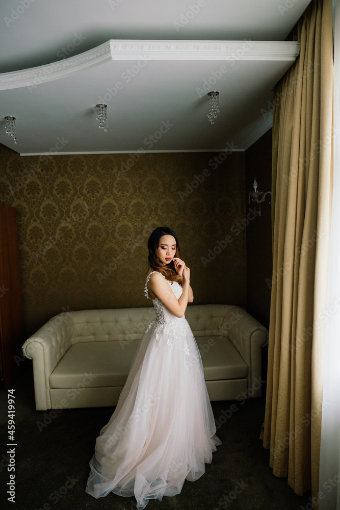 Young stylish asian woman in white dress, vintage style, natural, innocent, smiling in hotel