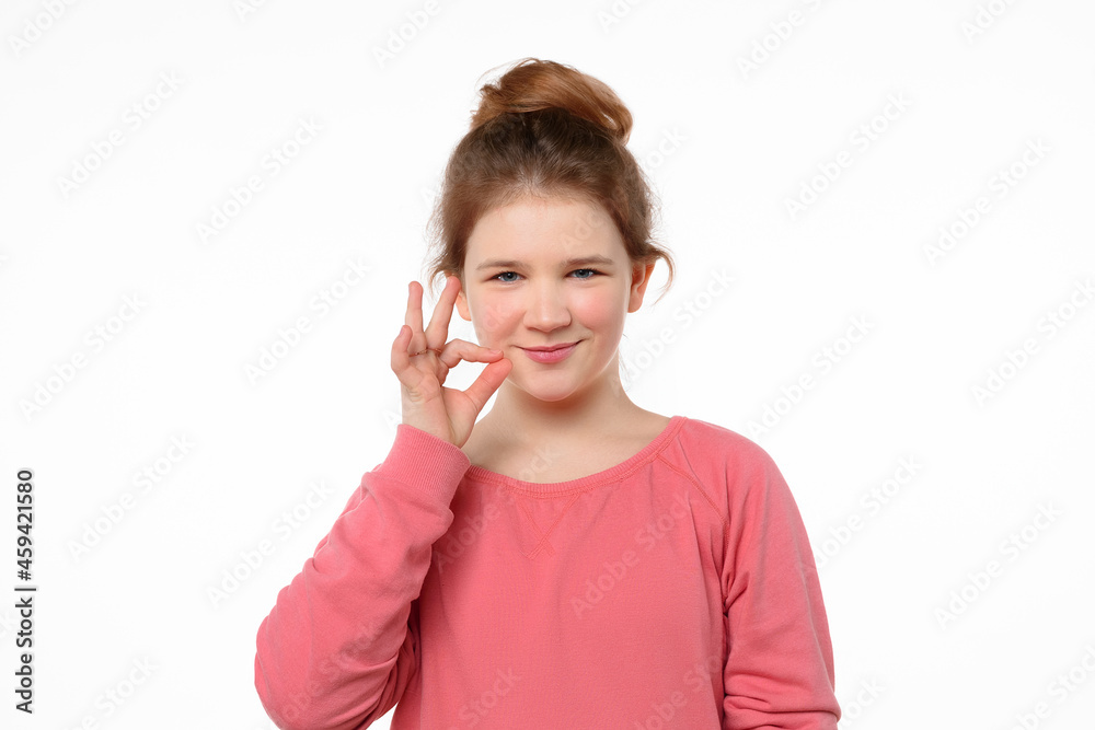Your secrets safe with me concept. Young girl showing zip gesture as if shutting mouth on key Your secrets safe with me concept. Young girl showing zip gesture as if shutting mouth on key
