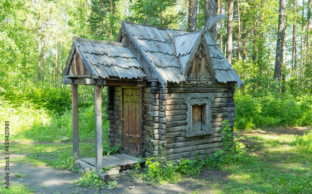 hut on chicken legs, the dwelling of Baba-Yaga in Russian fairy tales. Wooden House Grandmother in the forest hut on chicken legs, the dwelling of Baba-Yaga in Russian fairy tales. Wooden House Grandmother in the forest