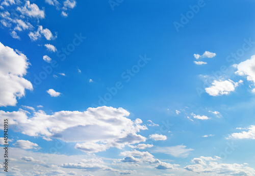 Beautiful sky with fluffy cirrocumulus clouds soft focus. Heavenly clouds background in summer day. Concept of freedom, relaxation, ecology. Copy space. Empty space for message. photo