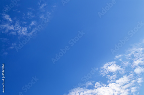 Blue sky with fluffy cirrus clouds soft focus. Heavenly clouds background summer. Concept of freedom, relaxation, ecology. Copy space. Empty space for your message.