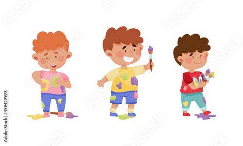 Cute funny creative boys in stained clothes painting with brushes set cartoon vector illustration