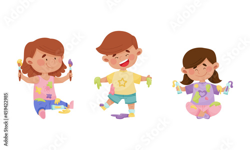 Cute funny creative boy and girls in stained clothes painting with paints and brushes set cartoon vector illustration