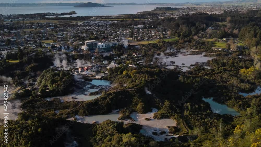 Amazing aerial scenic of Te Puia geothermal preserve. Bubbling mud pots, and the spouting Pohutu Geyser. Alongside steaming thermal pools. Amazing aerial scenic of Te Puia geothermal preserve. Bubbling mud pots, and the spouting Pohutu Geyser. Alongside steaming thermal pools.