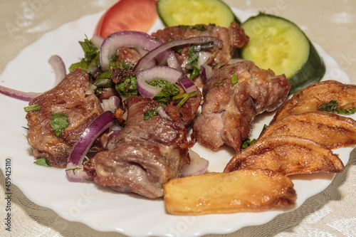 Pieces of fried lamb on the dish.