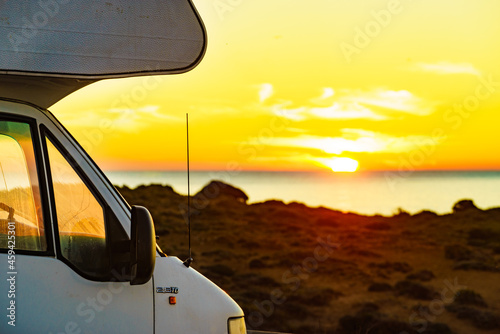 Camper vehicle on beach at sunrise © anetlanda