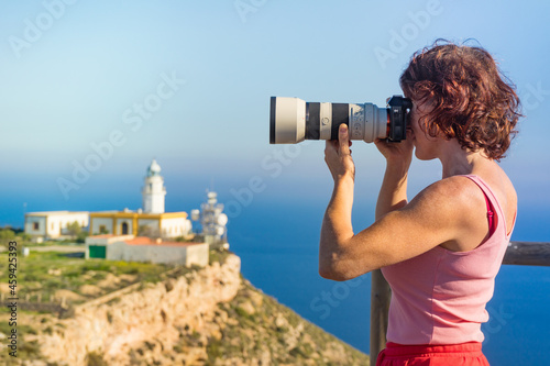 Tourist take photo at lighthouse, Cabo de Gata, Spain
