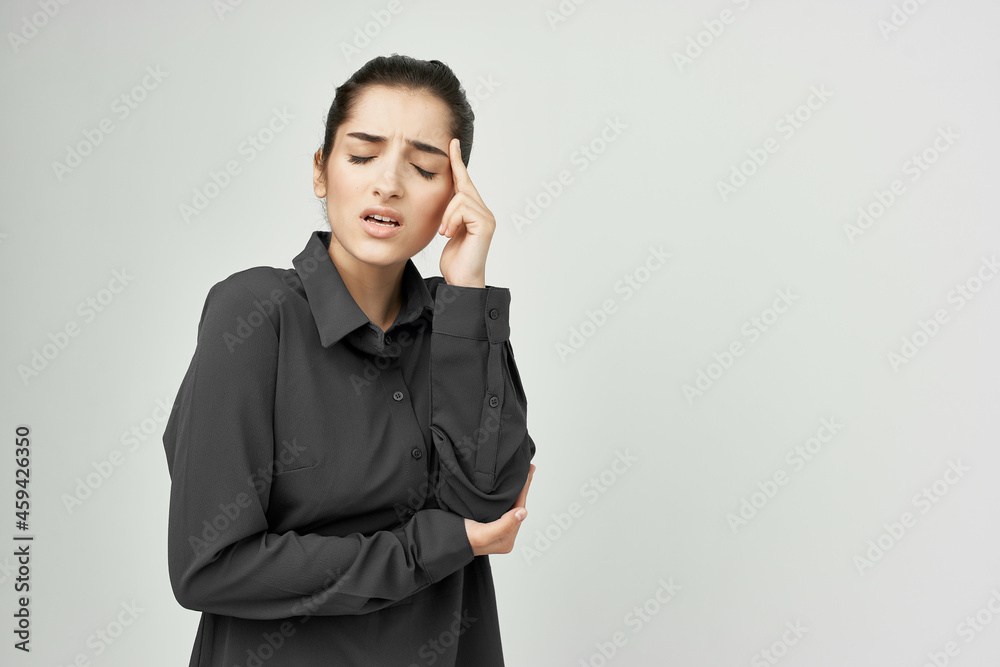 woman in black shirt migraine stress negative isolated background woman in black shirt migraine stress negative isolated background