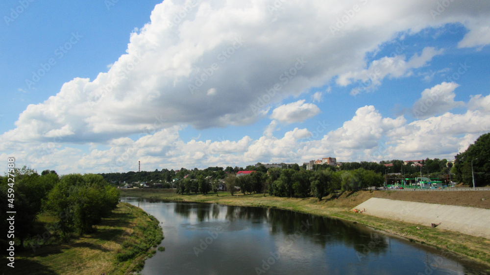 Landscape of nature. Blue lake, trees and sky Landscape of nature. Blue lake, trees and sky