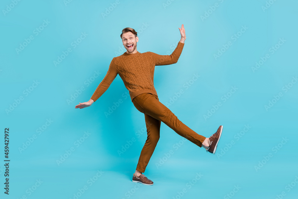 Fototapeta premium Full size photo of happy funny cheerful man dance funky good mood positive guy isolated on blue color background