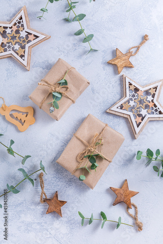 Fototapeta Naklejka Na Ścianę i Meble -  Holiday Christmas Gifts with Boxes, Coniferous, eucalyptus and ornaments