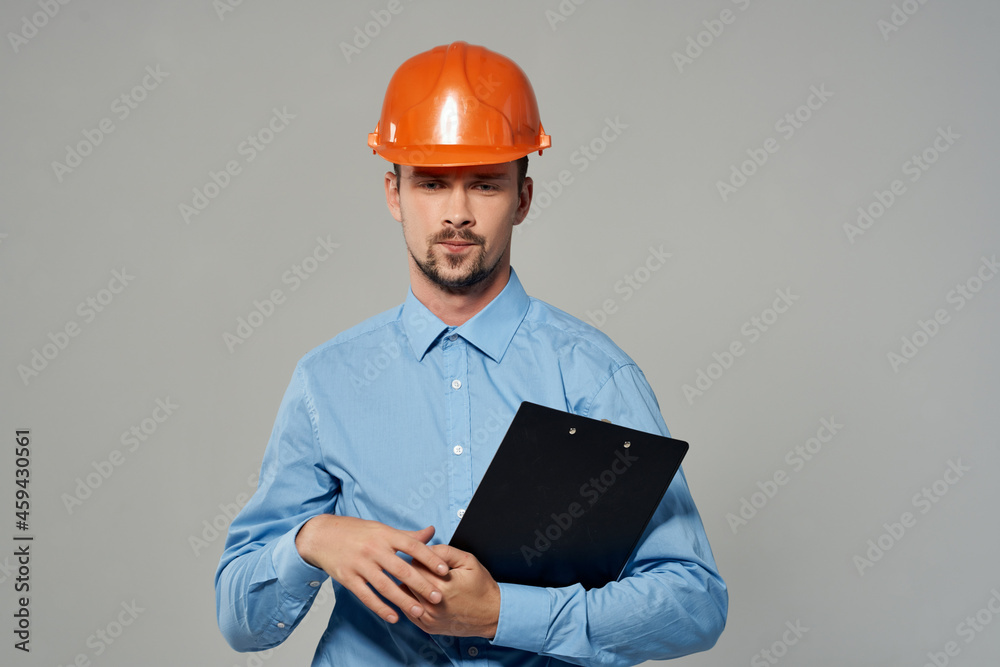 Man in a blue shirt emotions professional light background Man in a blue shirt emotions professional light background