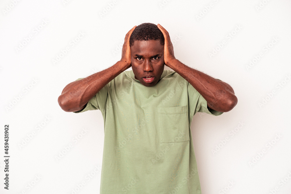 Young African American man isolated on white background being shocked, she has remembered important meeting. Young African American man isolated on white background being shocked, she has remembered important meeting.