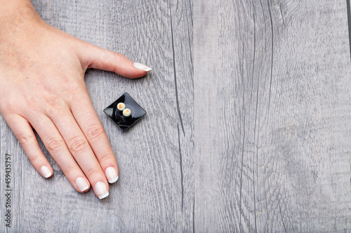 view from above, female hand with mini-sushi photo