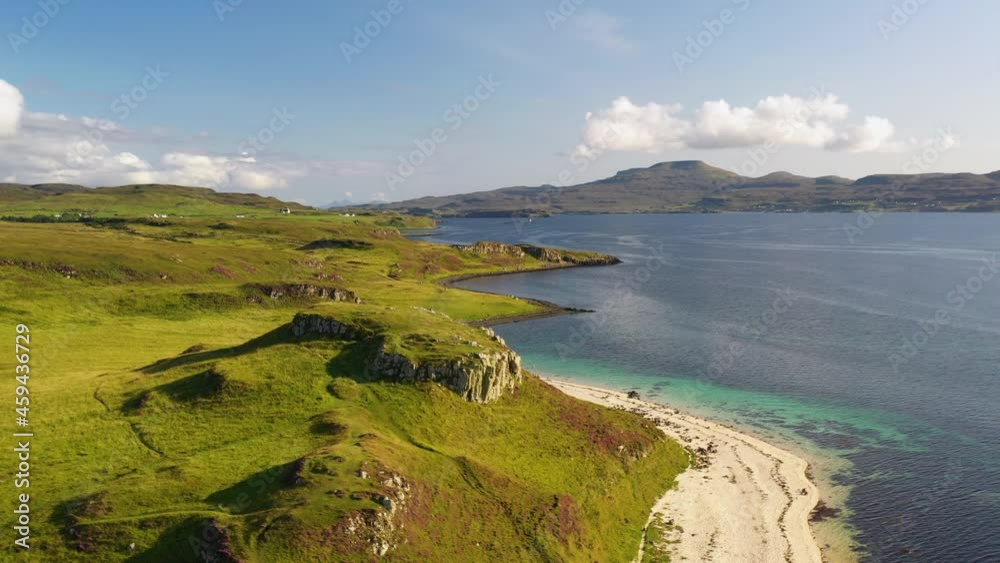 Wide rotating drone shot of Coral Beach in Claigan with white sandy beaches and tropical blue water, in Scotland Wide rotating drone shot of Coral Beach in Claigan with white sandy beaches and tropical blue water, in Scotland
