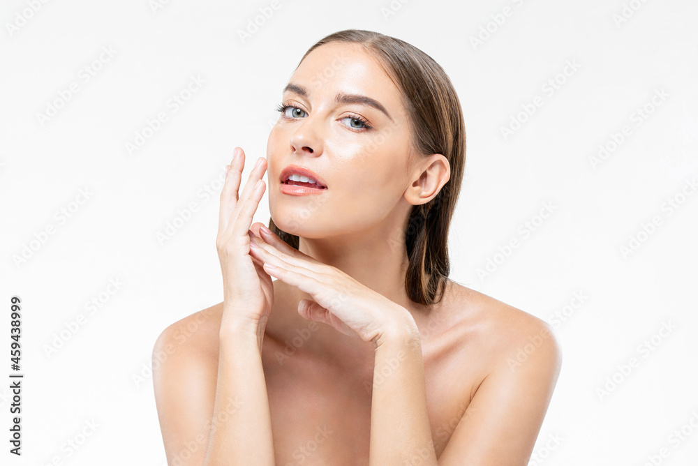 Beautiful young Caucasian woman with clean glowing face skin in isolated white studio background Beautiful young Caucasian woman with clean glowing face skin in isolated white studio background