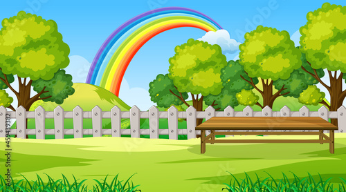Park landscape scene with rainbow in the sky