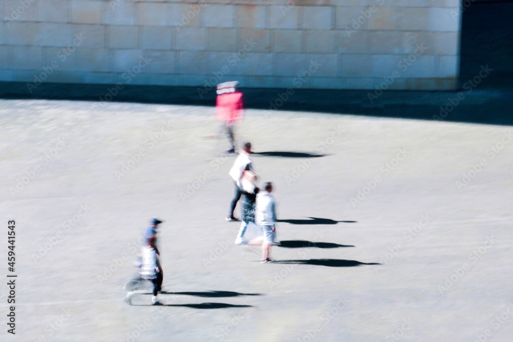 blurred people walking on the street in Bilbao city spain