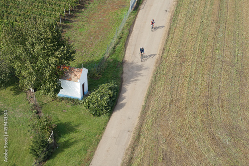 Popular cycling between wineyards and beautiful chapel aerial top view, Moravia wine region, Czechia photo