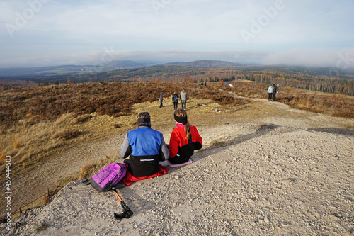 Hikers relaxing on the top of the Jordan hill, former military area in Brdy, Czech Republic