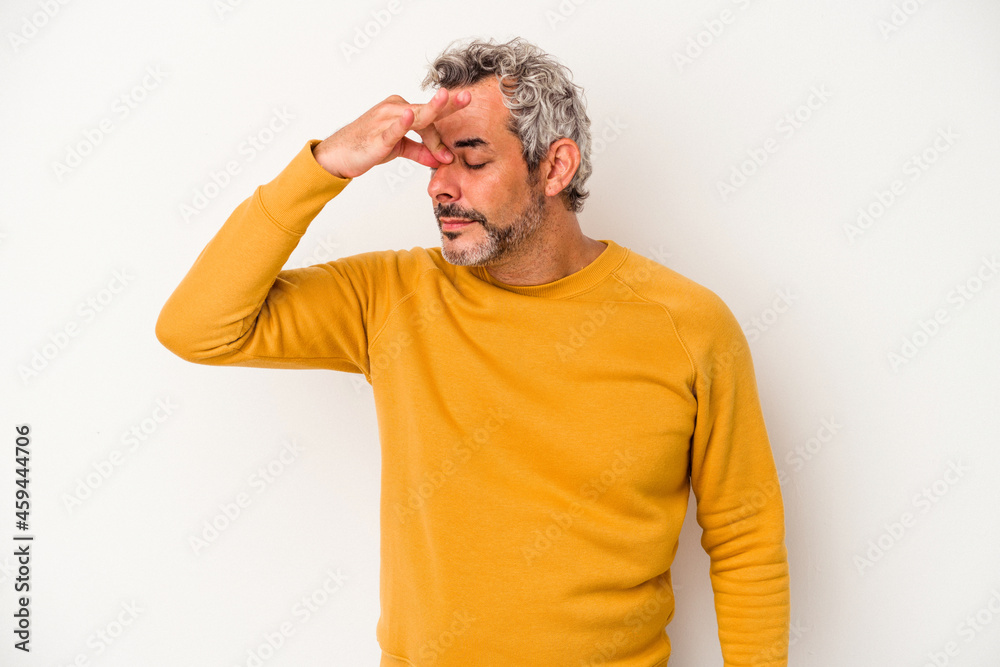 Middle age caucasian man isolated on white background  having a head ache, touching front of the face.