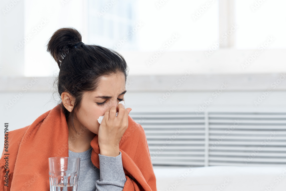 woman taking cover with plaid at home medication treatment discontent woman taking cover with plaid at home medication treatment discontent