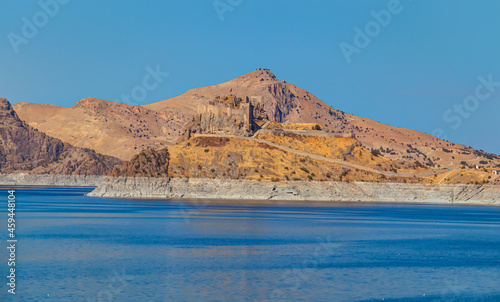 Pertek castle located in Pertek district of Tunceli - Pertek, Turkey Keban dam lake in the foreground