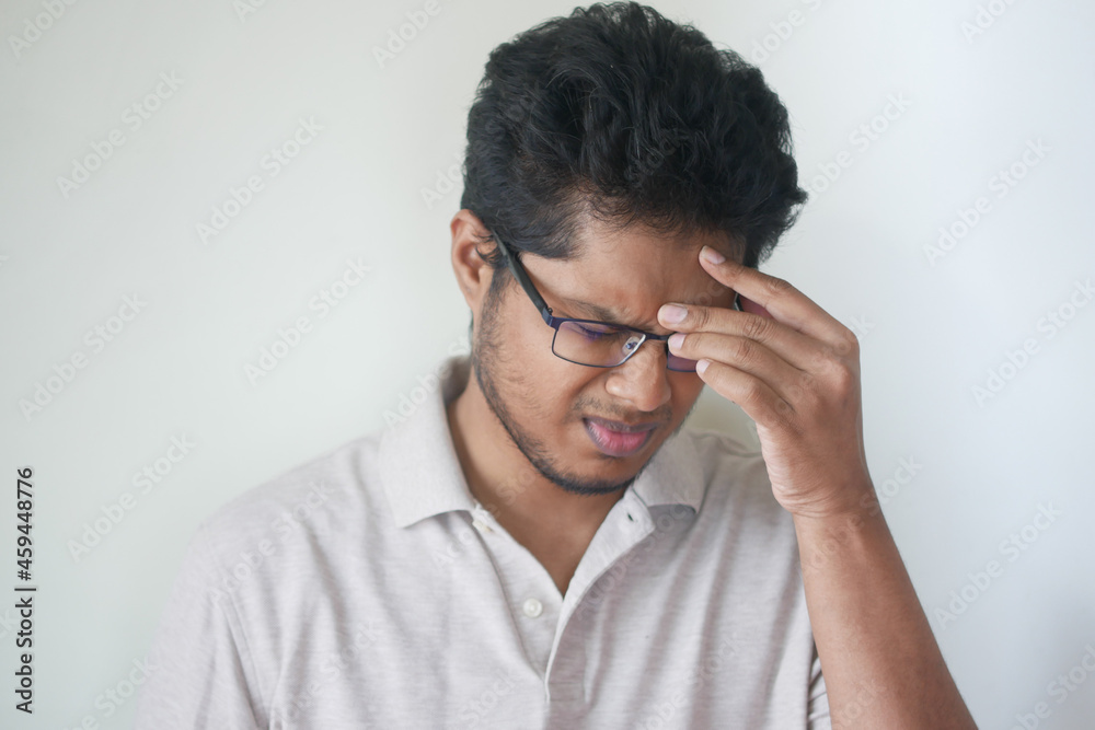 Depressed man feeling sick and worried about financial problem Depressed man feeling sick and worried about financial problem
