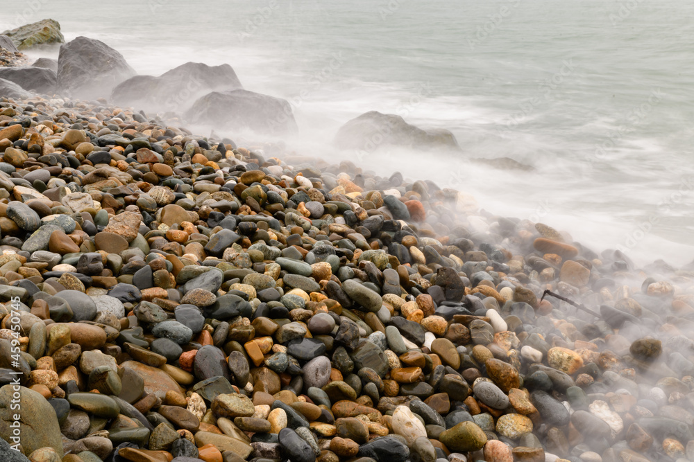 Scenic sunset on a rocky seashore on long exposure Scenic sunset on a rocky seashore on long exposure