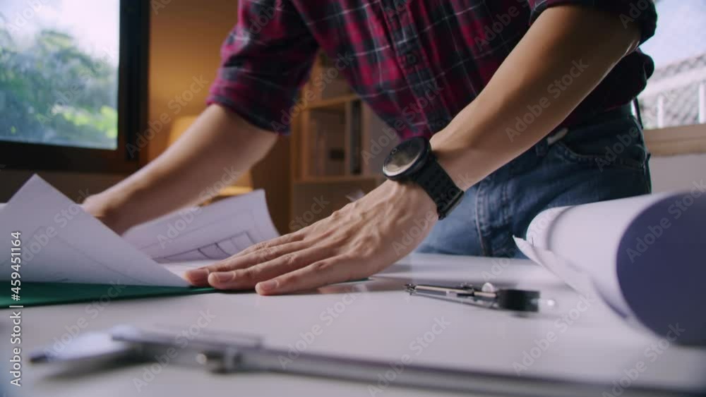 An architect is working in his home while covid-19 outbreak duration. WFH Work from home and engineer construction concept. An architect is working in his home while covid-19 outbreak duration. WFH Work from home and engineer construction concept.