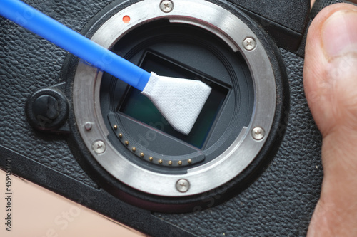 close up of cleaning camera sensor,