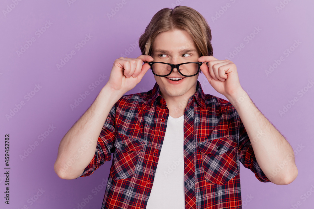 Portrait of curious amazed guy look empty space open mouth take off glasses on violet background Portrait of curious amazed guy look empty space open mouth take off glasses on violet background