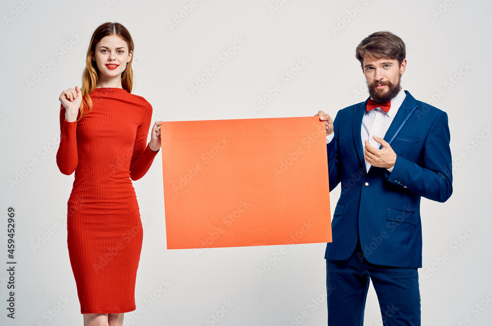 man and woman with red mockup advertising emotions studio man and woman with red mockup advertising emotions studio