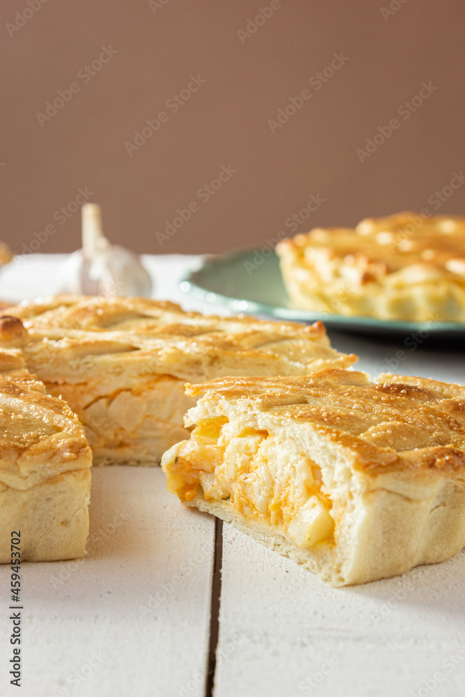 Brazilian Chicken Pie - Homemade Chicken Pie on Spatula on a Wooden Table Rustic Appeal Brazilian Chicken Pie - Homemade Chicken Pie on Spatula on a Wooden Table Rustic Appeal