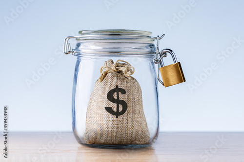 Money for Emergency fund in the glass jar. Concept financial security.