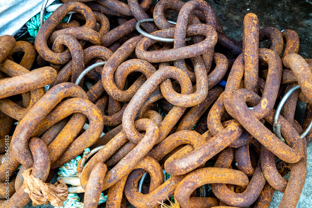 Old rusty chain stored on harbour pier Old rusty chain stored on harbour pier