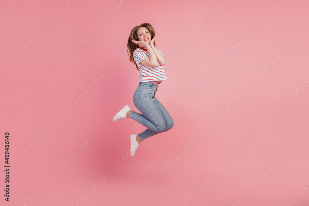 Portrait of sweet cute funky pretty lady jump hands face posing on pink background