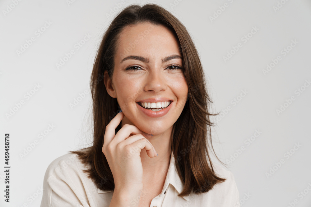Young european woman laughing and looking at camera Young european woman laughing and looking at camera