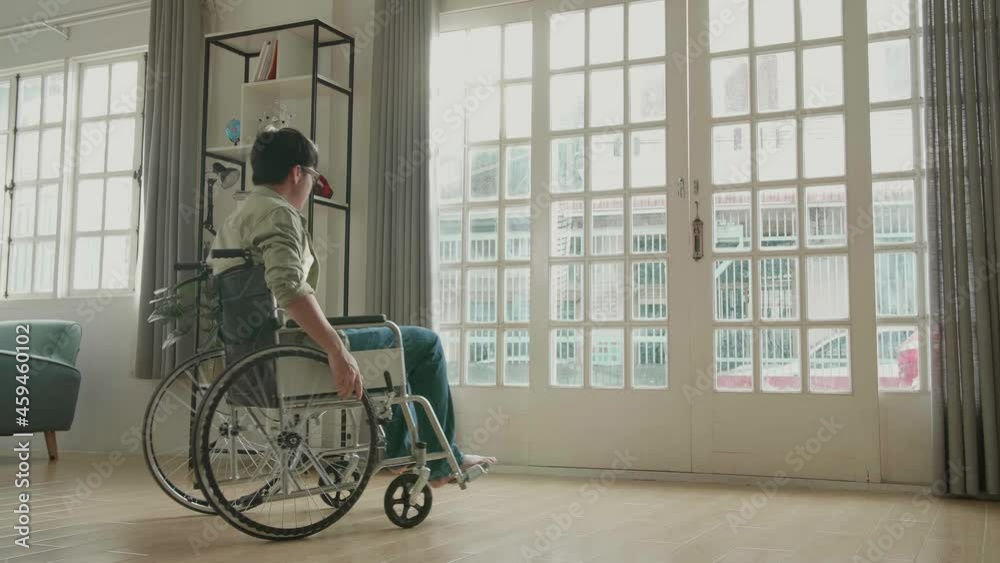 Asian Man Sitting In A Wheelchair Looking Out Of A Door
Asian Man Sitting In A Wheelchair Looking Out Of A Door
