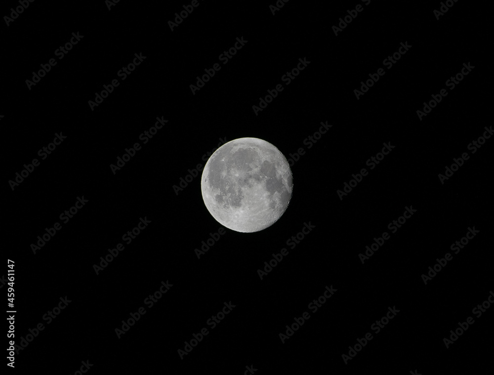 Close-up of full moon on black background Close-up of full moon on black background