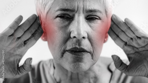 Tinnitus. Senior Woman Suffering From Tinnitus. photo