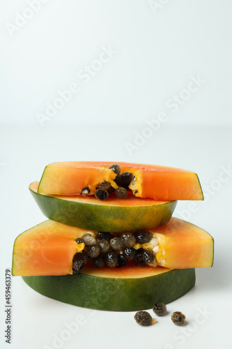 Fresh ripe papaya slices on white background