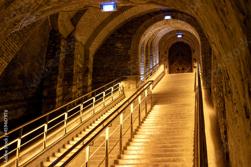 Staircase in deep and long undergrounds caves for making champagne sparkling wine from chardonnay and pinor noir grapes in Reims  Champagne  France