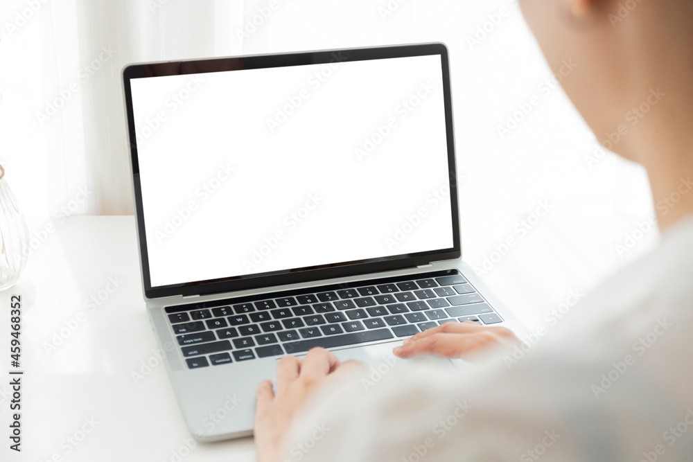 computer screen blank mockup.hand woman work using laptop with white background for advertising,contact business search information on desk at coffee shop.marketing and creative design computer screen blank mockup.hand woman work using laptop with white background for advertising,contact business search information on desk at coffee shop.marketing and creative design